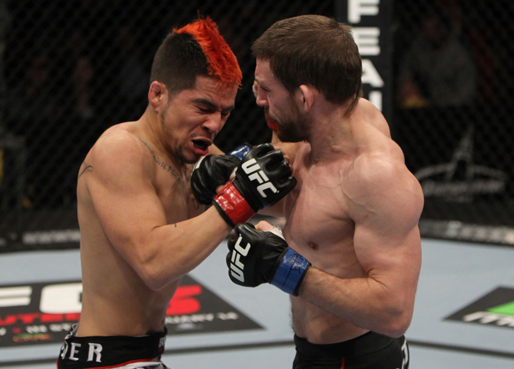 NASHVILLE, TN - JANUARY 20:  (R-L) Nick Denis punches Joseph Sandoval during the UFC on FX event at Bridgestone Arena on January 20, 2012 in Nashville, Tennessee.  (Photo by Josh Hedges/Zuffa LLC/Zuffa LLC via Getty Images)