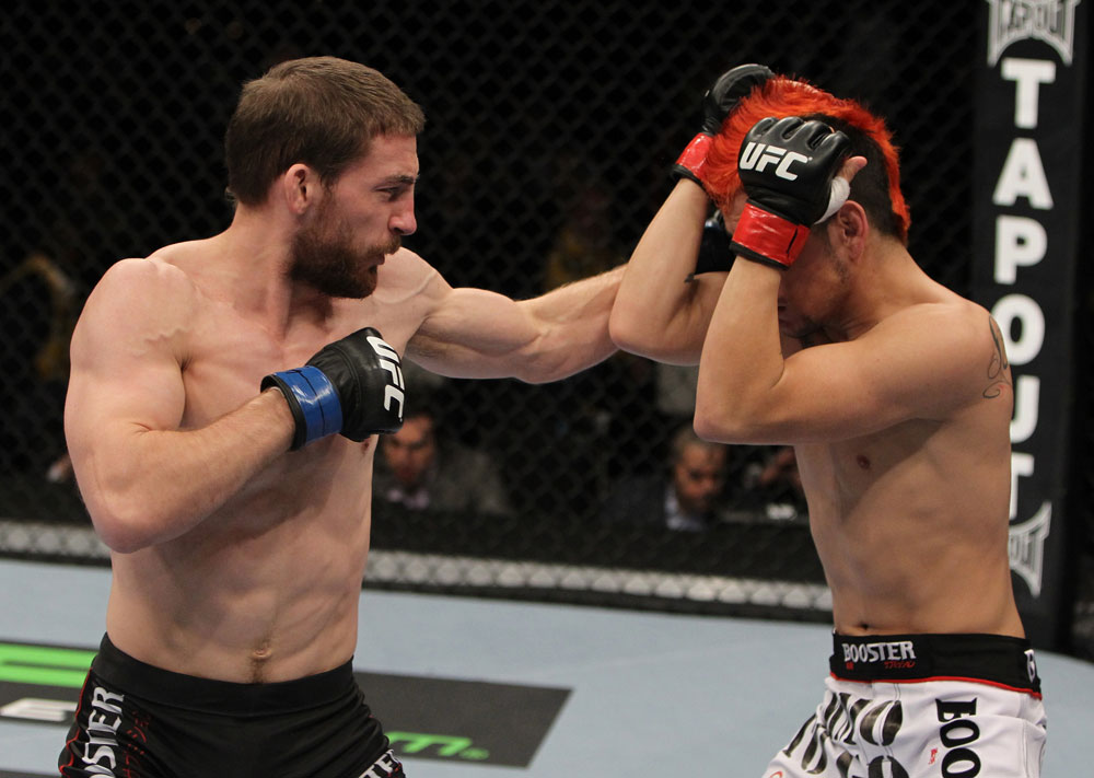 NASHVILLE, TN - JANUARY 20:  (L-R) Nick Denis punches Joseph Sandoval during the UFC on FX event at Bridgestone Arena on January 20, 2012 in Nashville, Tennessee.  (Photo by Josh Hedges/Zuffa LLC/Zuffa LLC via Getty Images)
