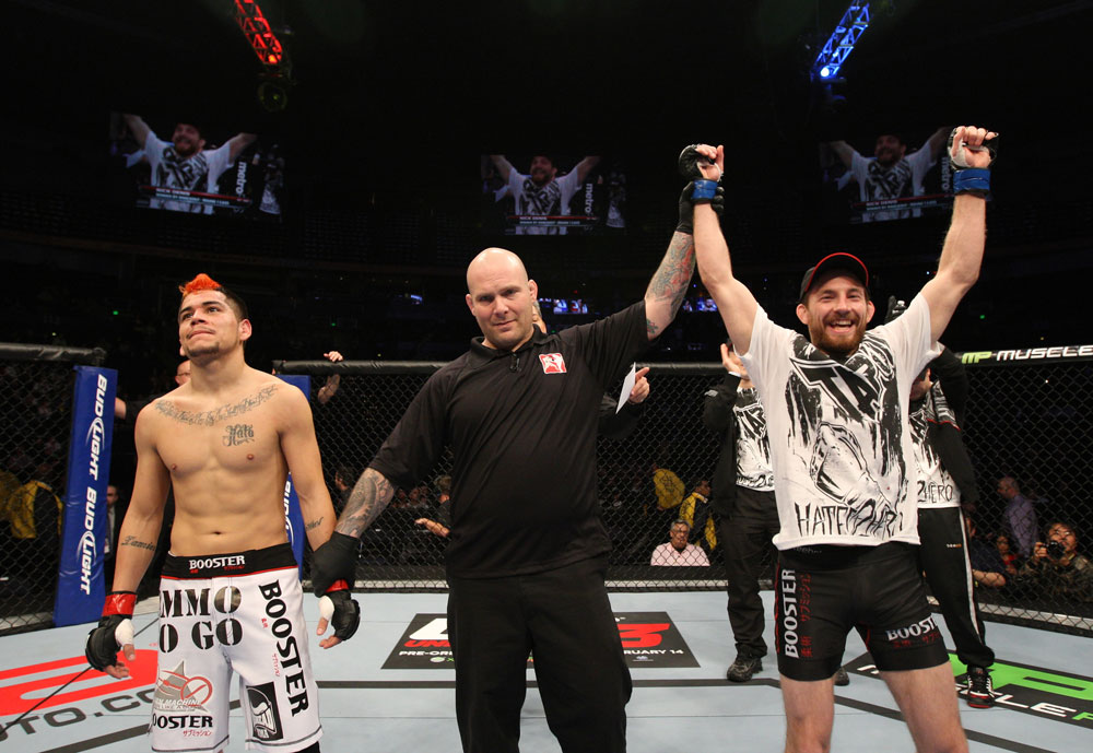 NASHVILLE, TN - JANUARY 20:  Nick Denis (R) reacts after knocking out Joseph Sandoval during the UFC on FX event at Bridgestone Arena on January 20, 2012 in Nashville, Tennessee.  (Photo by Josh Hedges/Zuffa LLC/Zuffa LLC via Getty Images)