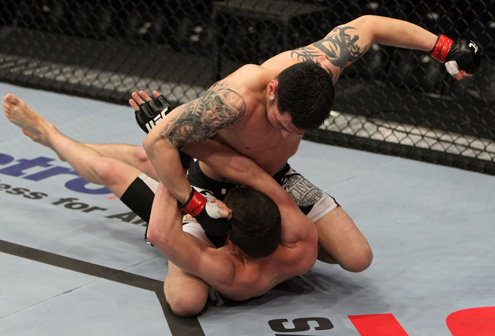 NASHVILLE, TN - JANUARY 20:  (R-L) Daniel Pineda punches Pat Schilling during the UFC on FX event at Bridgestone Arena on January 20, 2012 in Nashville, Tennessee.  (Photo by Josh Hedges/Zuffa LLC/Zuffa LLC via Getty Images)