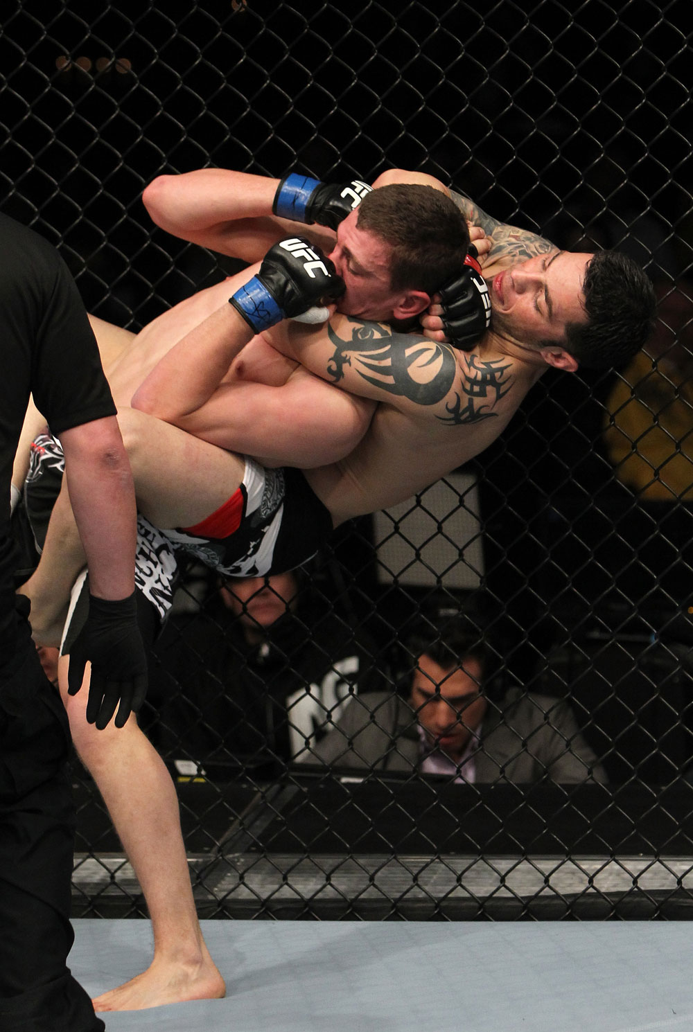 NASHVILLE, TN - JANUARY 20:  (R-L) Daniel Pineda secures a rear choke submission to defeat Pat Schilling during the UFC on FX event at Bridgestone Arena on January 20, 2012 in Nashville, Tennessee.  (Photo by Josh Hedges/Zuffa LLC/Zuffa LLC via Getty Images)