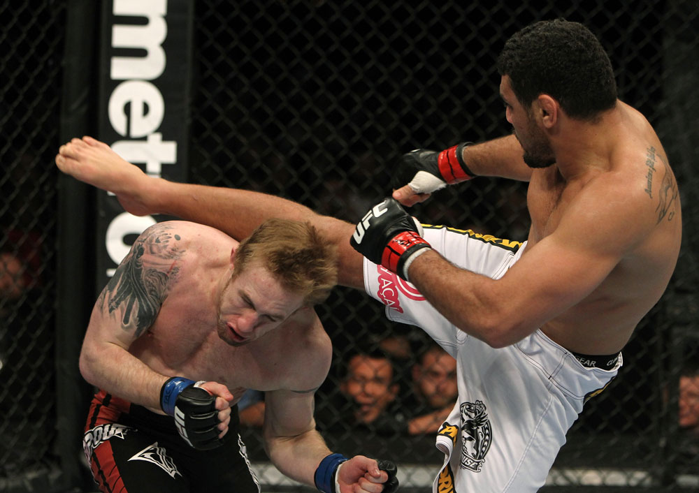 NASHVILLE, TN - JANUARY 20:  (R-L) Fabricio Camoes kicks Tommy Hayden during the UFC on FX event at Bridgestone Arena on January 20, 2012 in Nashville, Tennessee.  (Photo by Josh Hedges/Zuffa LLC/Zuffa LLC via Getty Images)