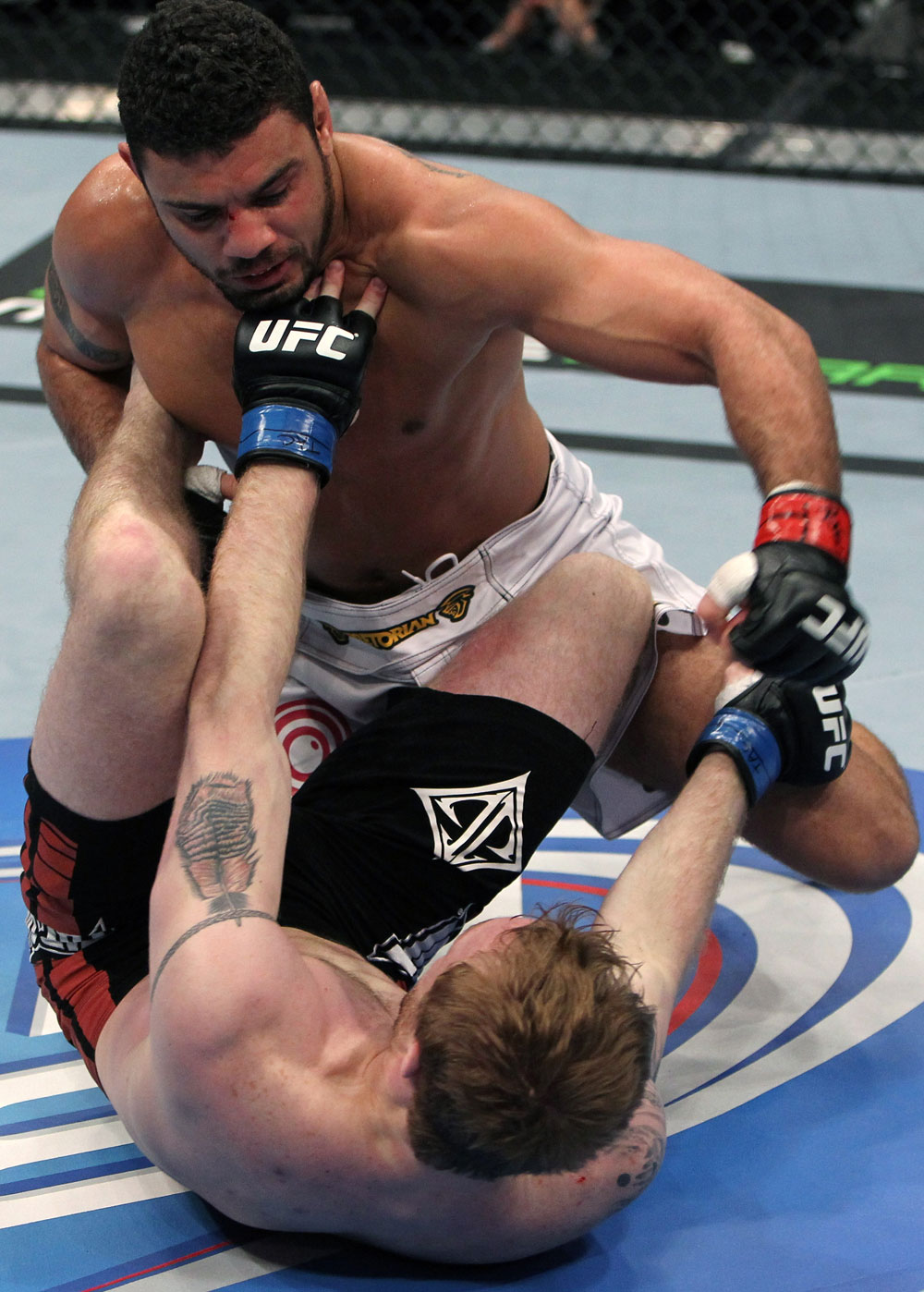 NASHVILLE, TN - JANUARY 20:  (L-R) Fabricio Camoes punches down at Tommy Hayden during the UFC on FX event at Bridgestone Arena on January 20, 2012 in Nashville, Tennessee.  (Photo by Josh Hedges/Zuffa LLC/Zuffa LLC via Getty Images)