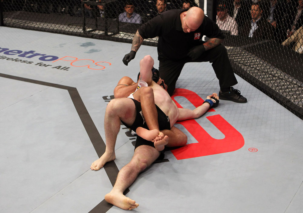 NASHVILLE, TN - JANUARY 20:  (L-R) Fabricio Camoes secures a rear choke submission against Tommy Hayden during the UFC on FX event at Bridgestone Arena on January 20, 2012 in Nashville, Tennessee.  (Photo by Josh Hedges/Zuffa LLC/Zuffa LLC via Getty Images)