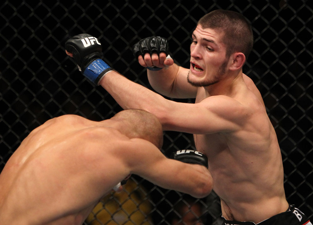 NASHVILLE, TN - JANUARY 20:  (R-L) Khabib Nurmagomedov punches Kamal Shalorus during the UFC on FX event at Bridgestone Arena on January 20, 2012 in Nashville, Tennessee.  (Photo by Josh Hedges/Zuffa LLC/Zuffa LLC via Getty Images)