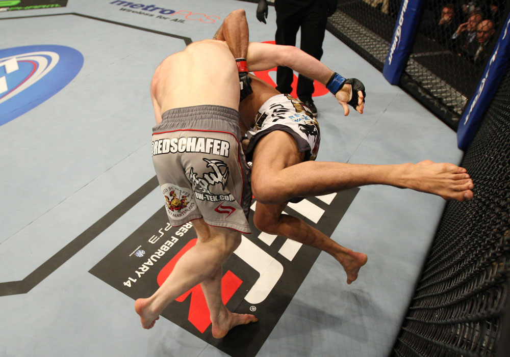 NASHVILLE, TN - JANUARY 20: (L-R) Eric Schafer takes down Jorge Rivera during the UFC on FX event at Bridgestone Arena on January 20, 2012 in Nashville, Tennessee. (Photo by Josh Hedges/Zuffa LLC/Zuffa LLC via Getty Images)