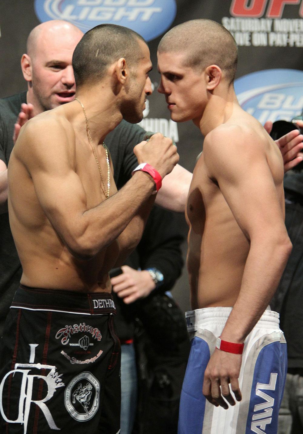 Lightweight opponents George Sotiropoulos (L) and Joe Lauzon (R) face off as UFC President Dana White looks on at the UFC 123 weigh-in at the Palace of Auburn Hills on November 19, 2010 in Auburn Hills, Michigan. (Photo by Josh Hedges/Zuffa LLC/Zuffa LLC via Getty Images)