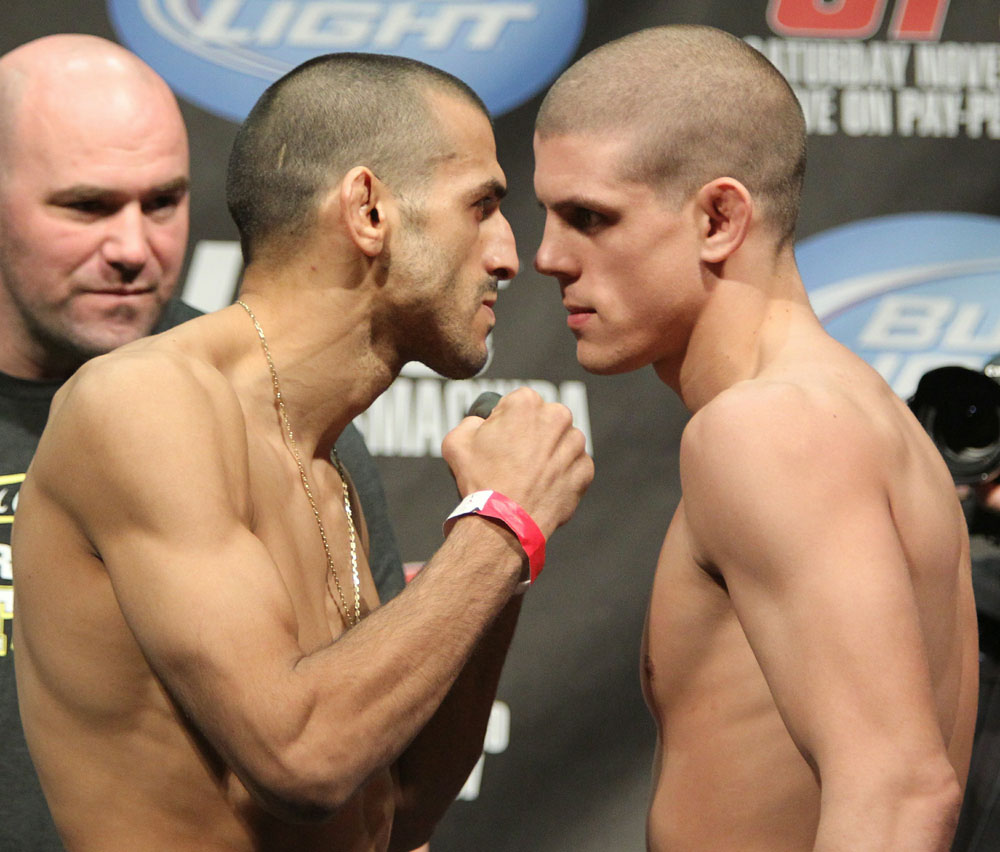 Lightweight opponents George Sotiropoulos (L) and Joe Lauzon (R) face off as UFC President Dana White looks on at the UFC 123 weigh-in at the Palace of Auburn Hills on November 19, 2010 in Auburn Hills, Michigan. (Photo by Josh Hedges/Zuffa LLC/Zuffa LLC via Getty Images)