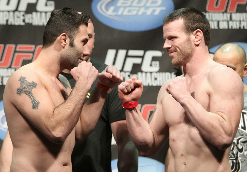 Welterweight opponents Karo Parisyan (L) and Dennis Hallman (R) face off at the UFC 123 weigh-in at the Palace of Auburn Hills on November 19, 2010 in Auburn Hills, Michigan.  (Photo by Josh Hedges/Zuffa LLC/Zuffa LLC via Getty Images)