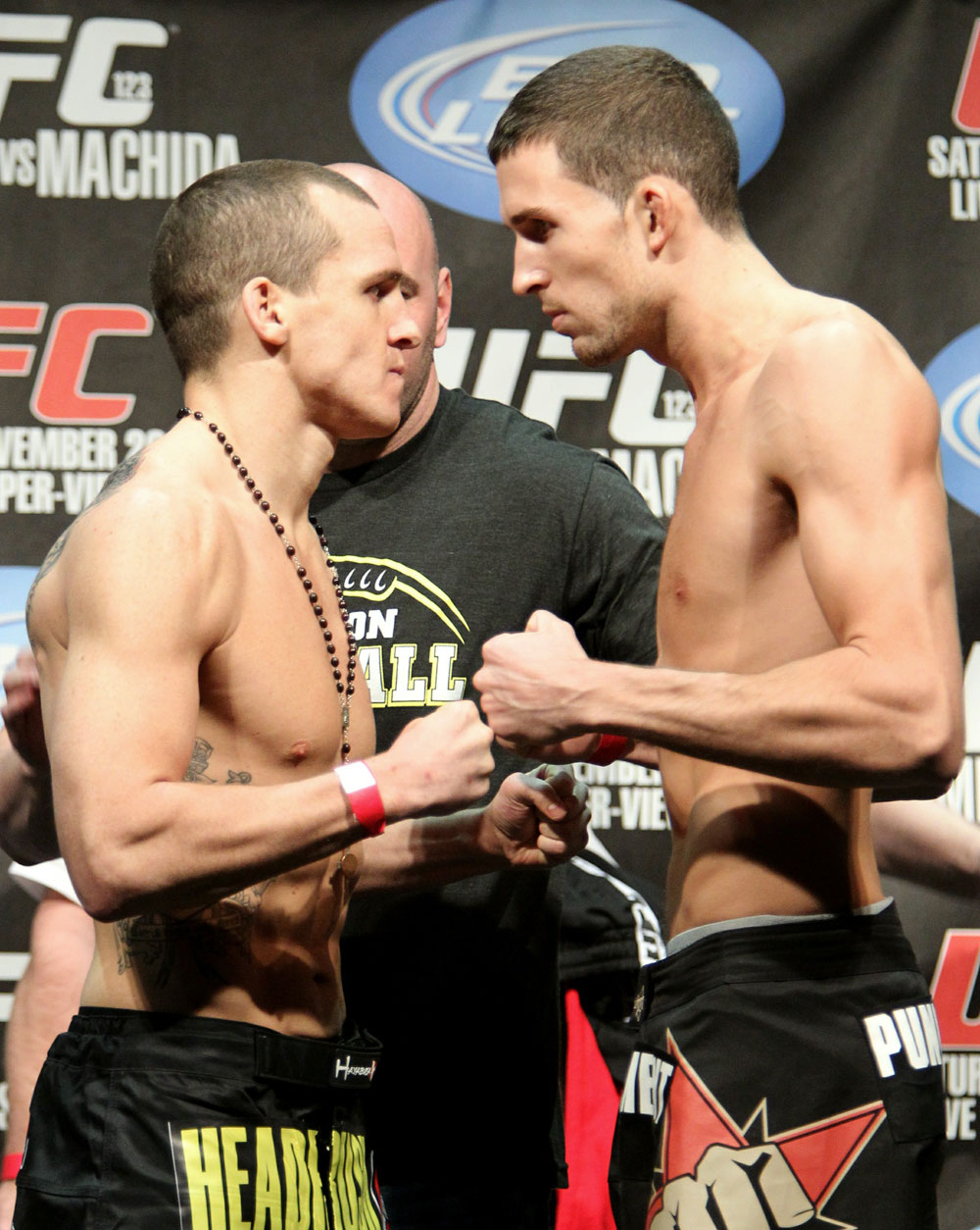 Lightweight opponents Paul Kelly (L) and TJ O'Brien (R) face off at the UFC 123 weigh-in at the Palace of Auburn Hills on November 19, 2010 in Auburn Hills, Michigan. (Photo by Josh Hedges/Zuffa LLC/Zuffa LLC via Getty Images)