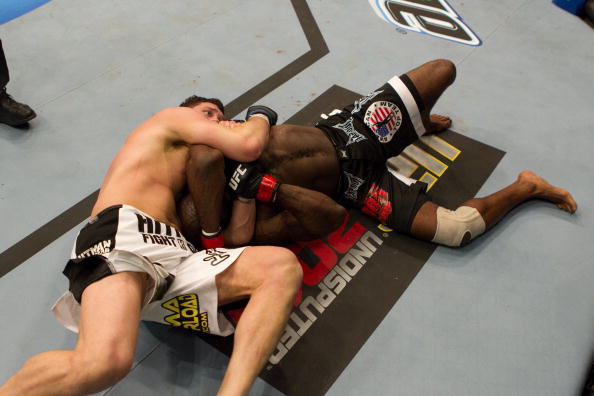 Mitrione locks in a choke against Kimbo Slice Mitrione locks in a choke against Kimbo Slice