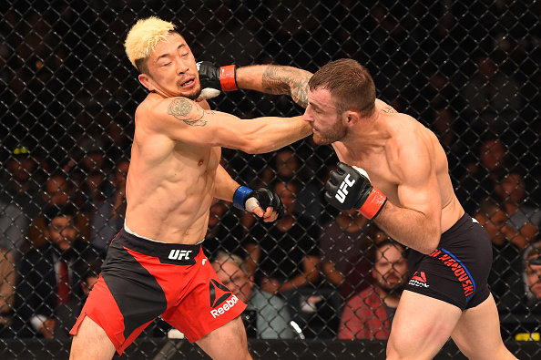 Alexander Volkanovski punches Mizuto Hirota during their featherweight bout at Fight Night Auckland