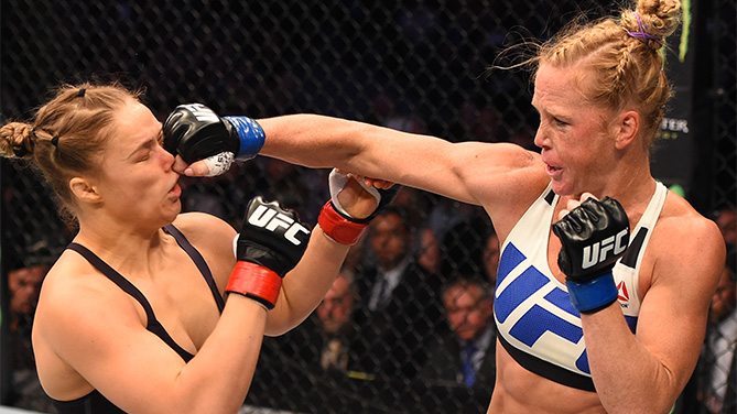 (R-L) Holly Holm of the United States punches Ronda Rousey of the United States in their UFC women's bantamweight championship bout during the UFC 193 event at Etihad Stadium on November 15, 2015 in Melbourne, Australia. (Photo by Josh Hedges/Zuffa LLC)