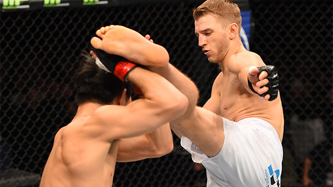 (R-L) Daniel Hooker kicks Hatsu Hioki in their featherweight bout during the UFC Fight Night event at the Adelaide Entertainment Centre on May 10, 2015 in Adelaide, Australia. (Photo by Josh Hedges/Zuffa LLC)