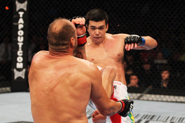 TORONTO, ON - APRIL 30: Lyoto Machida (back) kicks Randy Couture to win by knockout in the second round of their Light Heavyweight bout at UFC 129 in the Rogers Centre on April 30, 2011 in Toronto, Ontario. (Photo by Al Bello/Zuffa LLC/Zuffa LLC via Getty Images)