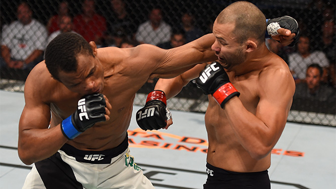 (L-R) Francisco Trinaldo of Brazil punches Chad Laprise in their lightweight bout during the UFC event at the SaskTel Centre on August 23, 2015 in Saskatoon, Saskatchewan, Canada. (Photo by Jeff Bottari/Zuffa LLC)