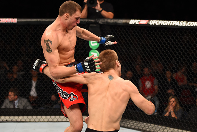 (L-R) James Vick knees Jake Matthews in their lightweight bout during the UFC Fight Night event at the Adelaide Entertainment Centre on May 10, 2015 in Adelaide, Australia. (Photo by Josh Hedges/Zuffa LLC)