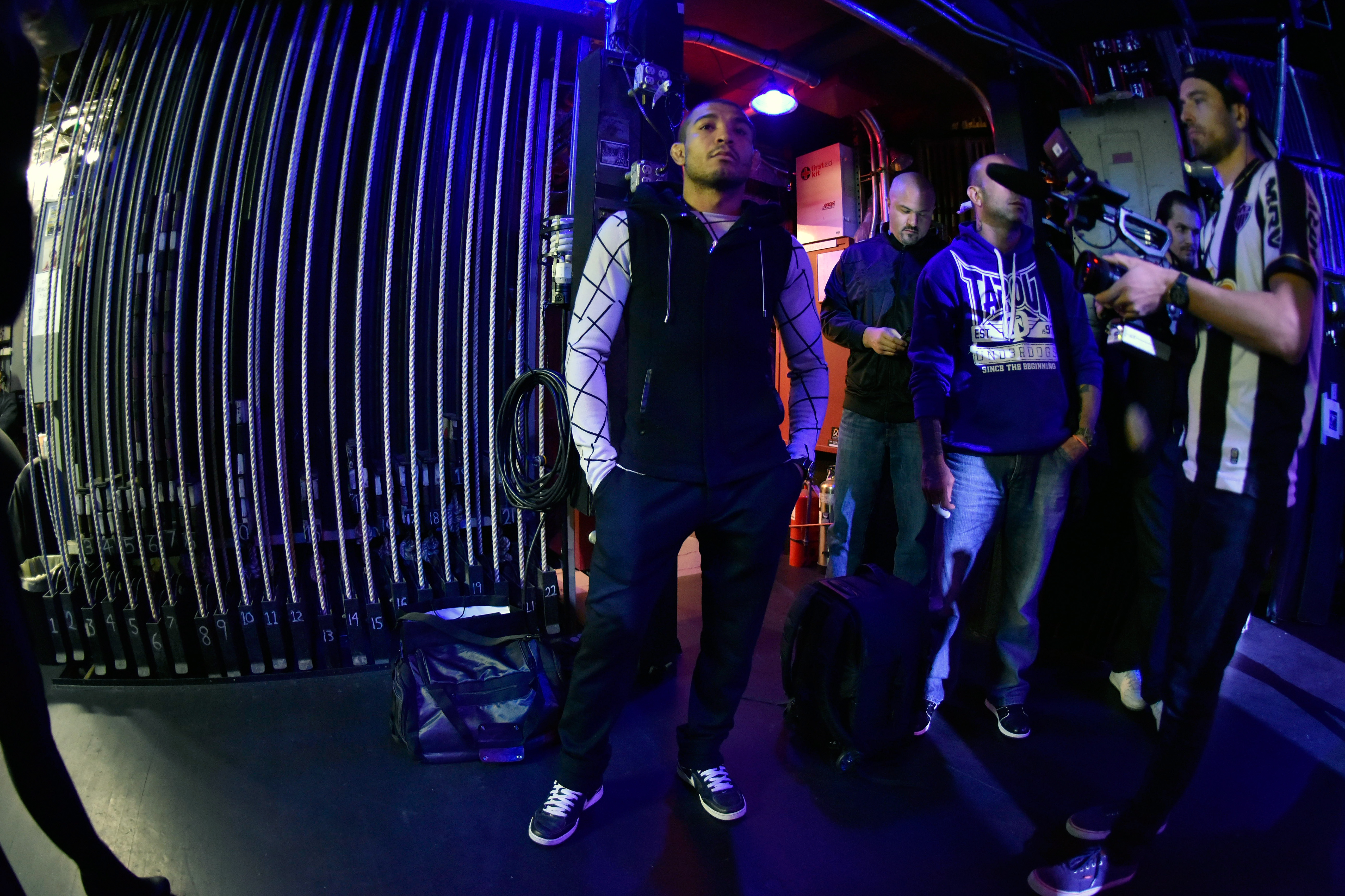 Aldo (left) waits backstage before NY press conference