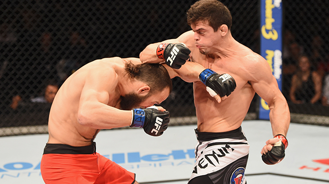 Magalhaes (right) punches Smith
