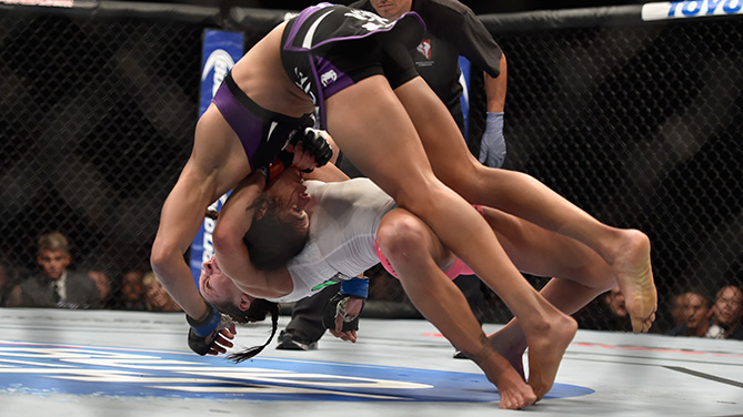 Zingano throws Nunes during their UFC 178 fight