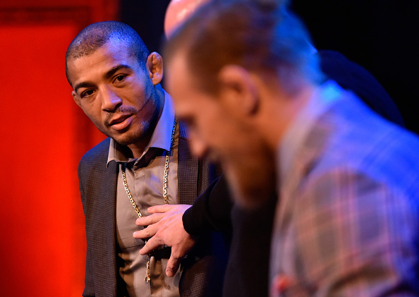 Aldo (left) looks at McGregor during staredown