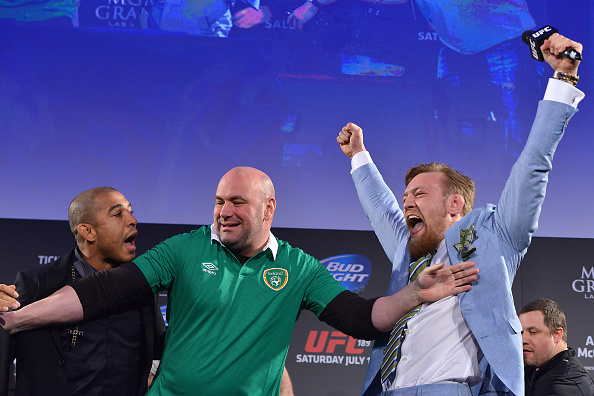 DUBLIN, IRELAND - MARCH 31: UFC featherweight title challenger Conor 'The Notorious' McGregor (R) steals UFC Featherweight Champion Jose Aldo's (L) belt as UFC President Dana White (C) separates the two during the UFC 189 World Championship Fan Event on March 31, 2015 in Dublin, Ireland. (Photo by Jeff Bottari/Zuffa LLC/Zuffa LLC via Getty Images)
