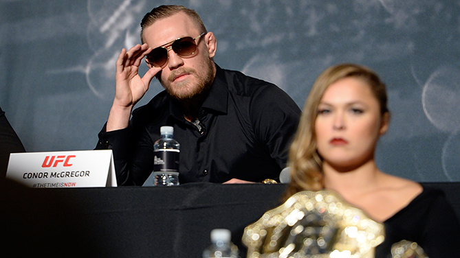 Conor McGregor (top) and Ronda Rousey