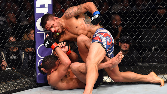 Rafael dos Anjos of Brazil controls the body of Anthony Pettis in their UFC lightweight championship bout during the UFC 185 event at the American Airlines Center on March 14, 2015 in Dallas, Texas. (Photo by Josh Hedges/Zuffa LLC)