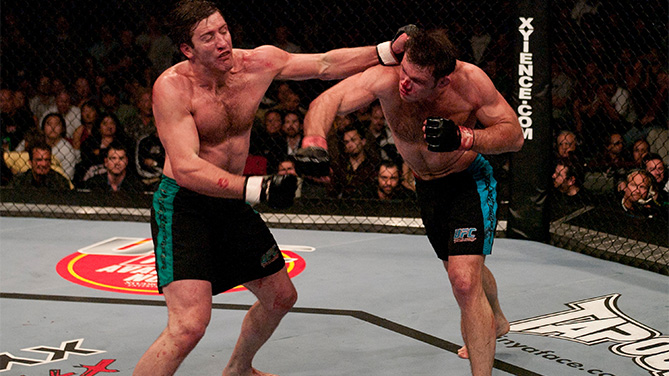 LAS VEGAS, NV - APRIL 09: (R-L) Forrest Griffin and Stephan Bonnar trade punches during the Light Heavyweight Final bout during the live Ultimate Fighter Season Finale at the Cox Pavilion on April 9, 2005 in Las Vegas, Nevada. (Photo by Josh Hedges/Zuffa LLC/Zuffa LLC via Getty Images)