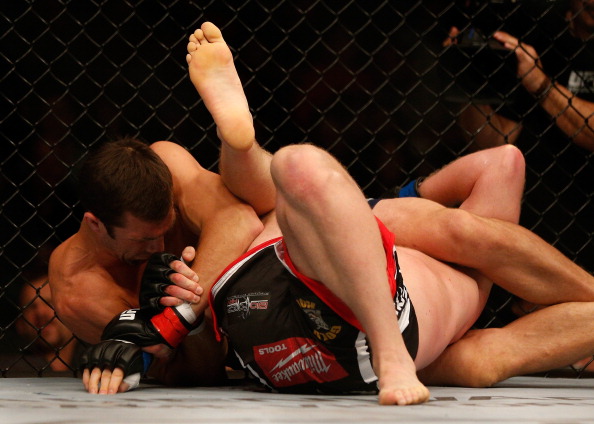 BALTIMORE, MD - APRIL 26: (L-R) Luke Rockhold secures a kimura submission against Tim Boetsch in their middleweight bout during the UFC 172 event at the Baltimore Arena on April 26, 2014 in Baltimore, Maryland. (Photo by Josh Hedges/Zuffa LLC/Zuffa LLC via Getty Images)