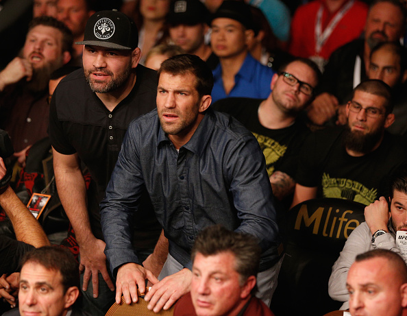 LAS VEGAS, NV - JANUARY 03: UFC middleweight Luke Rockhold and UFC heavyweight champion Cain Velasquez look on as their teammate Daniel Cormier competes at UFC 182 at the MGM Grand Garden Arena on January 3, 2015 in Las Vegas, Nevada. (Photo by Josh Hedges/Zuffa LLC/Zuffa LLC via Getty Images)