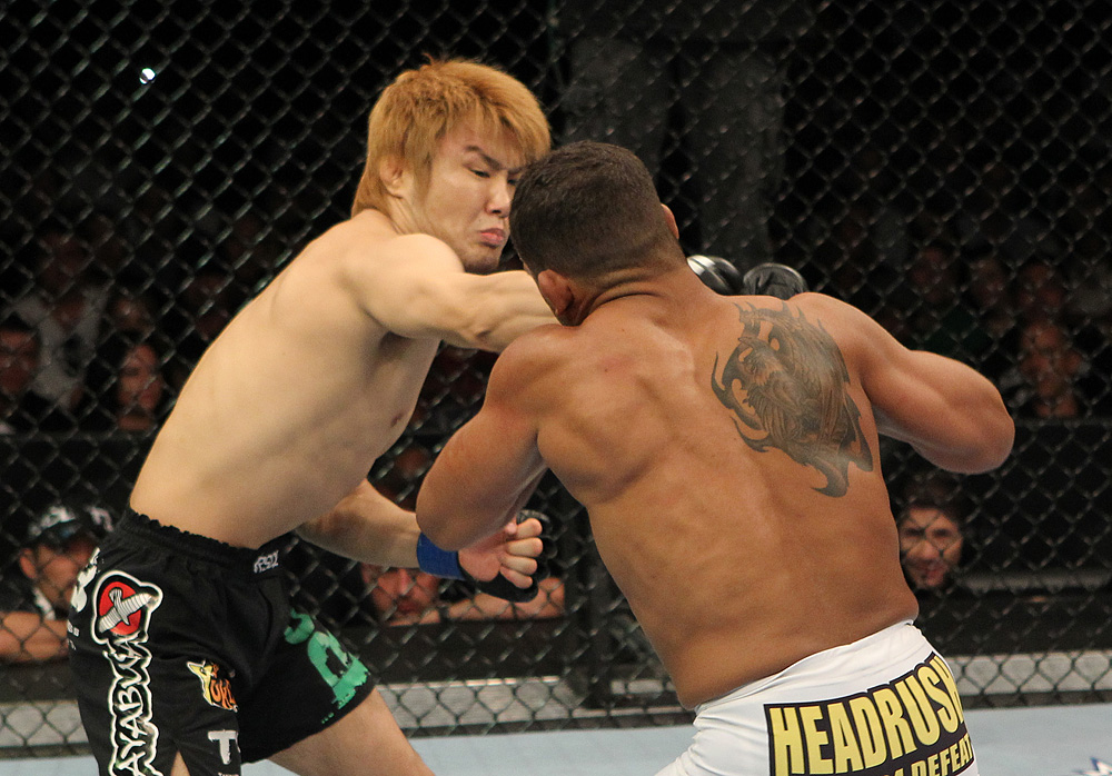 Takanori Gomi punches <a href='../fighter/Tyson-Griffin'>Tyson Griffin</a> during their bout from 2010