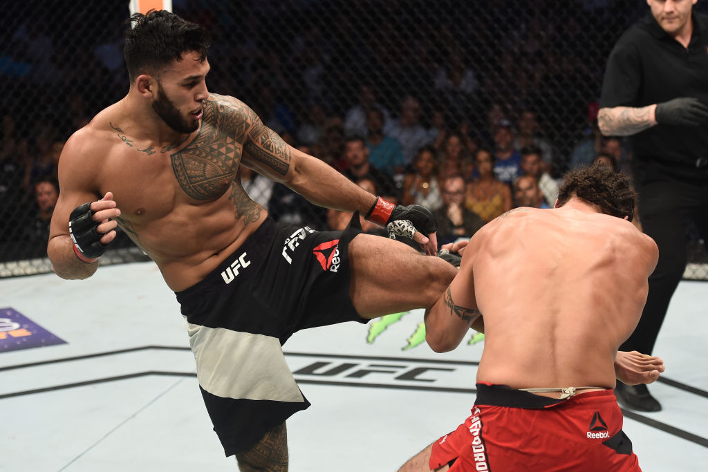 LAS VEGAS, NV - JULY 07: (L-R) <a href='../fighter/Brad-Tavares'><a href='../fighter/Brad-Tavares'>Brad Tavares</a></a> kicks <a href='../fighter/elias-theodorou'><a href='../fighter/elias-theodorou'>Elias Theodorou</a></a> of Canada in their middleweight bout during The Ultimate Fighter Finale at T-Mobile Arena on July 7, 2017 in Las Vegas, Nevada. (Photo by Brandon Magnus/Zuffa LLC)