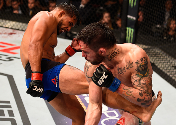 Bermudez kicks Rony Jason during the UFC Fight Night on August 6, 2016 in Salt Lake City, UT. (Photo by Jeff Bottari/Zuffa LLC)
