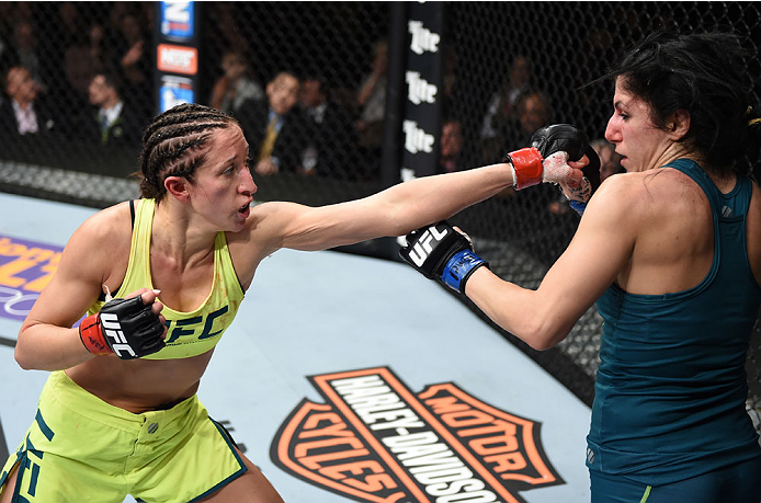 LAS VEGAS, NEVADA - DEC. 12: (L-R) Jessica Penne punches Randa Markos in their strawweight fight during The Ultimate Fighter Finale event. (Photo by Jeff Bottari/Zuffa LLC)